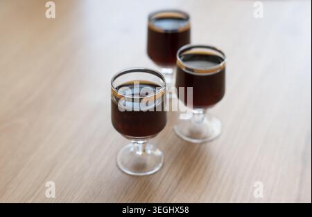 Herbal liqueur in a glass, drinking alcohol. Stock Photo