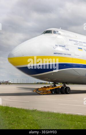 Schkeuditz, Germany - 9 May, 2026.Front massive Antonov AN-124 Ruslan cargo aircraft parked on airport apron under dramatic cloudy sky Stock Photo