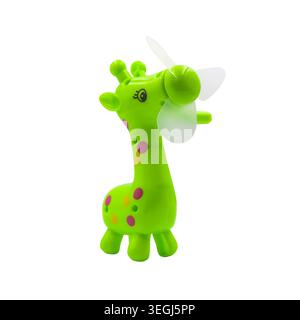 Cute green giraffe toy manual hand fan isolated on white background. Stock Photo