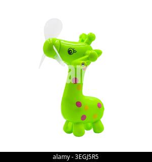 Cute green giraffe toy manual hand fan isolated on white background. Stock Photo