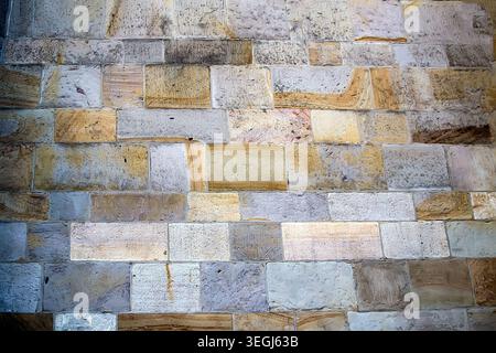Stone pavement in perspective. Stone pavement texture. Granite cobblestoned pavement background. Stock Photo