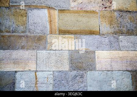 Stone pavement in perspective. Stone pavement texture. Granite cobblestoned pavement background. Stock Photo