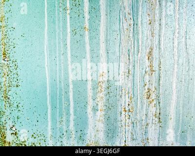Textured Abstract of Weathered Teal Wall with Organic Patterns and Vertical Streaks Stock Photo