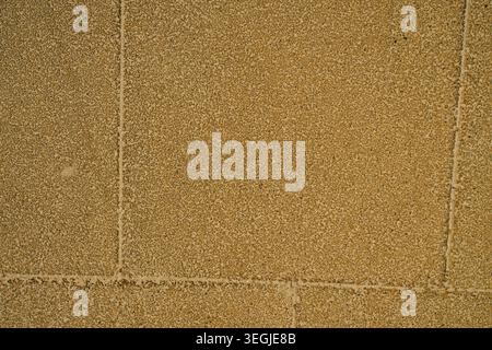 Aesthetic geometric background of textured outdoor rubber mat pavement, perfect for construction Stock Photo