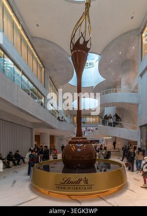 The massive chocolate fountain inside the Lindt Home of Chocolate museum hall, Zurich, Switzerland Stock Photo