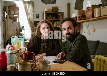 Portrait of Middle Aged Couple Reviewing Household Budget Stock Photo