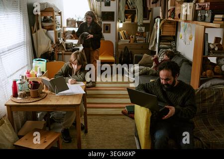 Family Managing Financial Hardship While Working and Studying at Home Stock Photo