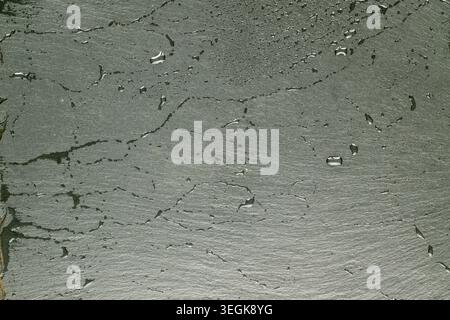 Slate stone surface with water drops, macro, top view. Stock Photo