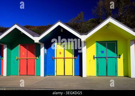 Colourful painted bathing huts at Barry Island beach, South Wales, UK Stock Photo