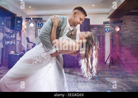 happy, laughing bride and groom at the wedding.The first wedding dance. Celebrate an emotional wedding. Stock Photo