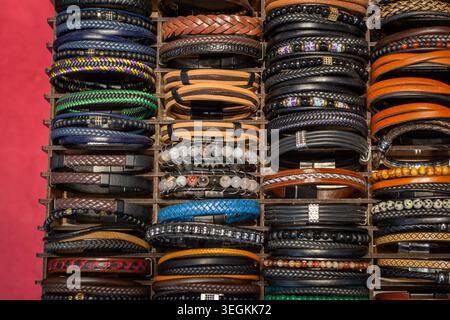 Global Village, Dubai, UAE- November 23, 2025: Assortment of handmade leather and beaded bracelets for sale at Global Village Dubai market stall. Stock Photo