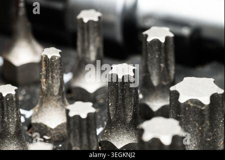 Close-up macro shot of a set of Torx screwdriver bits in a toolbox Stock Photo