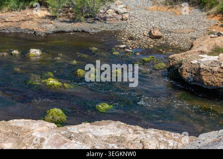 Small Stream Flowing Into the Mediterranean Sea Estuary Coastal Landscape Stock Photo