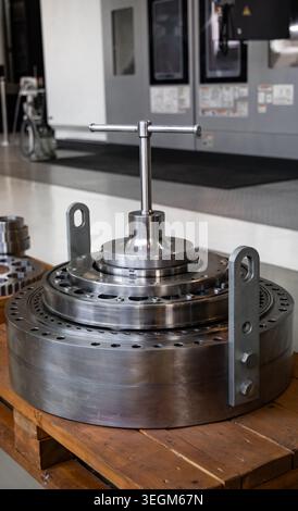 Precision Industrial Mechanical Component in Modern Manufacturing Facility Stock Photo