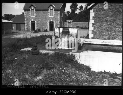 Water is filtered at the Saint-Brieuc water treatment facility in 1911. Workers operate filtration and treatment equipment as part of municipal water purification, reflecting early 20th-century French public health infrastructure. Stock Photo