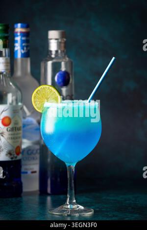 Refreshing Blue Cocktail Garnished With Lime Slice Creates a Vibrant Drink Experience Stock Photo