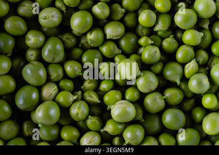 Close-up view of fresh green peas filling the frame. Stock Photo