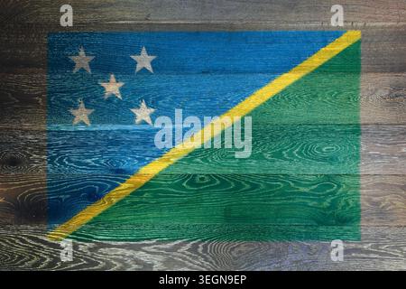 Solomon islands flag on rustic old wood surface background Stock Photo