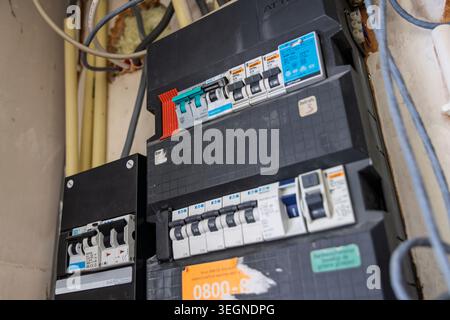 Rotterdam, Netherlands - May 18, 2026: An angled close-up photo of a home electrical distribution panel showing various automatic fuses and wire condu Stock Photo