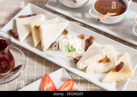 Rich Mediterranean Breakfast Served Outdoors, Abundant Traditional Turkish Breakfast with Fresh Bread, Cheese, Olives, Eggs and Seasonal Ingredients Stock Photo
