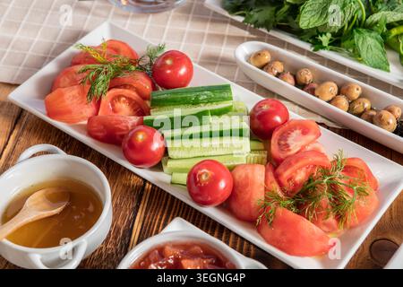 Rich Mediterranean Breakfast Served Outdoors, Abundant Traditional Turkish Breakfast with Fresh Bread, Cheese, Olives, Eggs and Seasonal Ingredients Stock Photo
