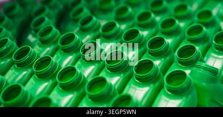 High Angle View of Green Plastic Bottles on Factory Conveyor Belt Stock Photo