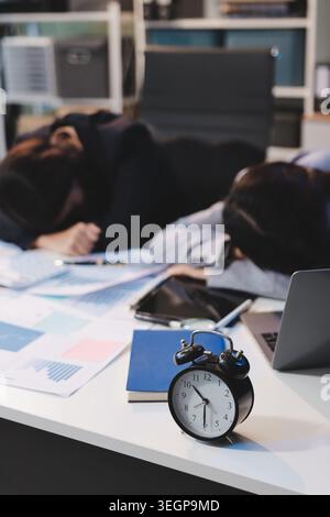 Asian women are stressed while working on laptop, Tired asian businesswoman with headache at office, feeling sick at work, copy space Stock Photo