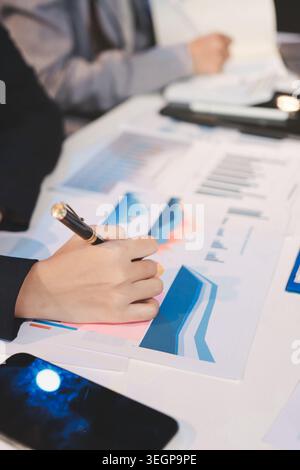 Team of business people working together in the meeting room office, teamwork background charts and graphs banner, double exposure successful teamwork Stock Photo