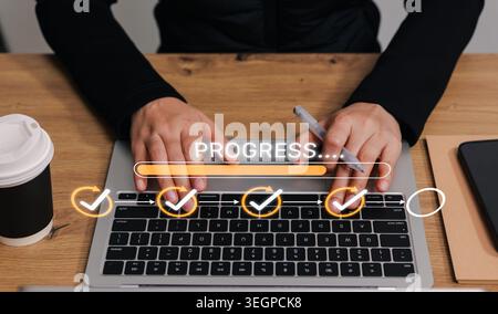 Project progress tracking and task completion workflow concept. Person using laptop with virtual progress bar, check marks, checklist, Stock Photo