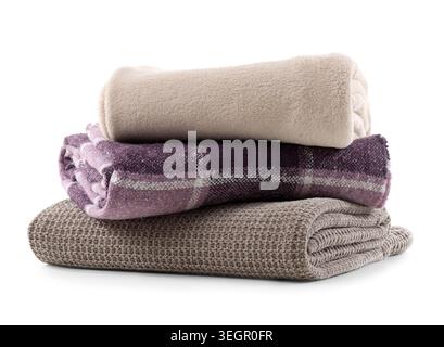 Stack of cozy blankets isolated on white background Stock Photo