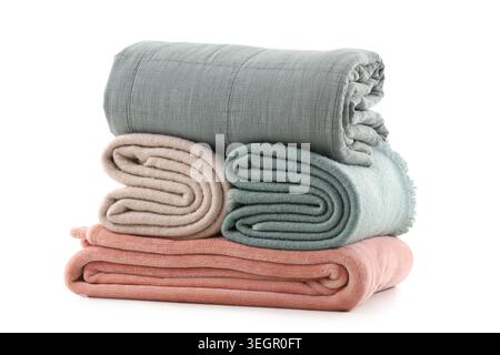 Stack of different folded blankets isolated on white background Stock Photo