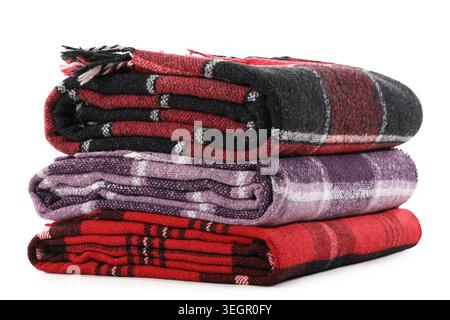 Stack of cozy blankets isolated on white background Stock Photo