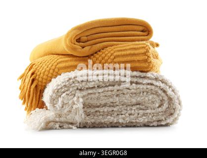 Stack of cozy knitted blankets isolated on white background Stock Photo