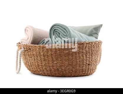Wicker basket with different cozy blankets isolated on white background Stock Photo