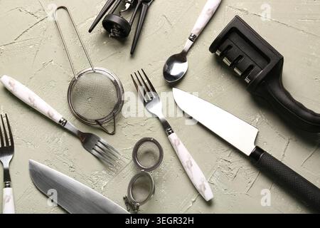 Different kitchen utensils on grey background Stock Photo