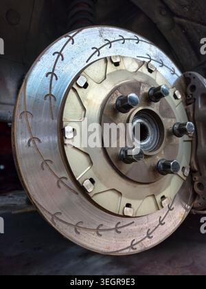 High performance slotted car brake rotor close up view Stock Photo