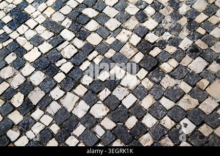 Pavement of black and white. The geometrical pattern. The texture of the pavement Stock Photo