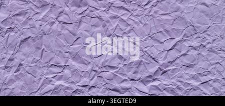 Crumpled purple paper texture background with wrinkled surface and natural shadows Stock Photo