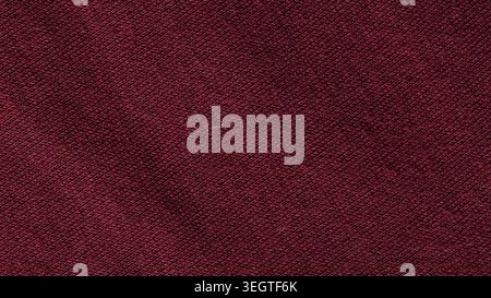 Dark crimson red knitted cotton fabric texture with fine diagonal weave pattern Stock Photo