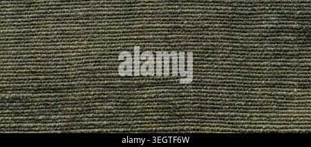 Dark green wool carpet texture with horizontal ribbed weave for a rustic interior background Stock Photo