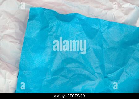 Creative abstract background featuring layered blue and white crumpled paper textures. Modern artistic backdrop suitable for design, stationery and cr Stock Photo