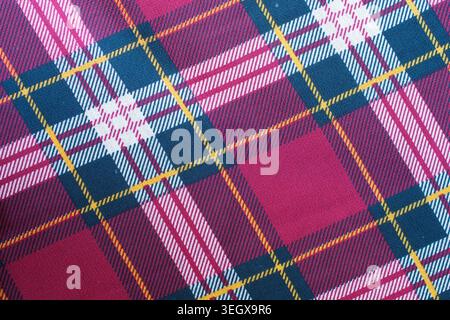 Red, blue and white plaid fabric texture with yellow stripes Stock Photo