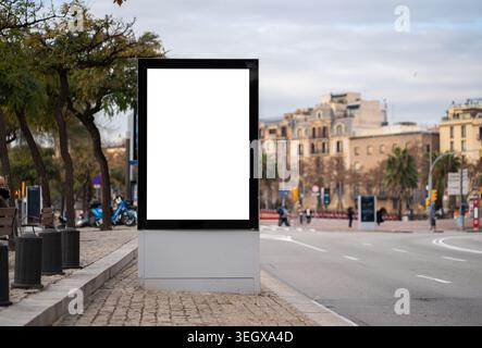 Blank vertical digital advertisement sign mock-up displaying empty white screen Stock Photo