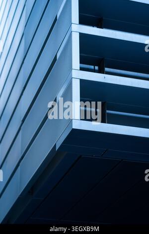 Modern architectural facade featuring geometric shapes and parallel lines Stock Photo