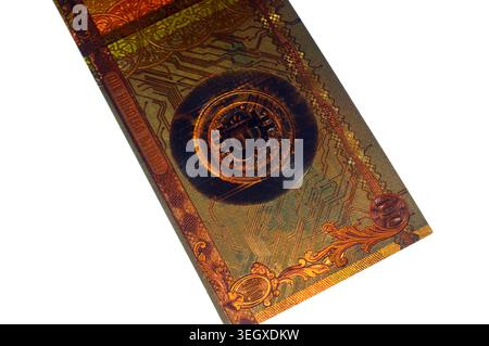 Cairo, Egypt, May 14 2026: the reverse side of gold plated novelty 100 bitcoin BTC note, features Bitcoin symbol on circuit board, cryptocurrency and Stock Photo