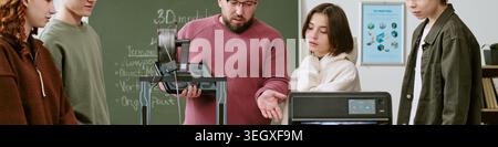 Header of Teacher and Teenagers Using 3d Printer in Classroom Workshop Stock Photo