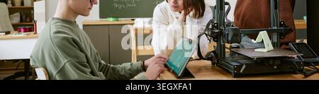 Header of Teenagers Using Tablet and 3d Printer in Classroom Stem Project Stock Photo