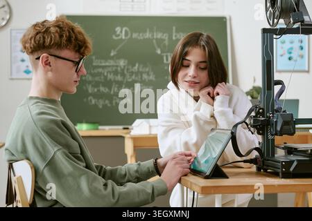 Teenagers Learning 3d Printing and Digital Design in Classroom Stock Photo