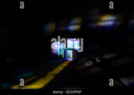 Transparent cubes with neon light reflections on dark textured background Stock Photo