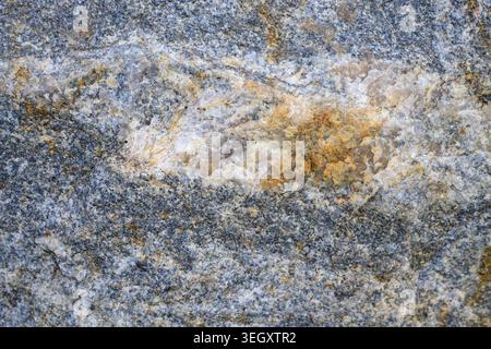 Smooth igneous rock plate pattern. Detailed crystalline structure of durable material used for kitchen countertops, floors and building facades. Abstr Stock Photo